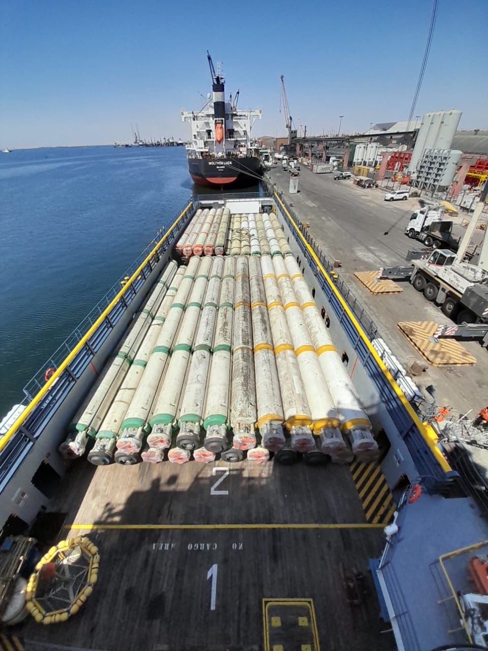 Deepsea Mira drilling riser joints on a PSV deck at Walvis Bay's Jetty 8 – post-campaign riser demobilisation to Afrishore's offshore supply base, Namibia